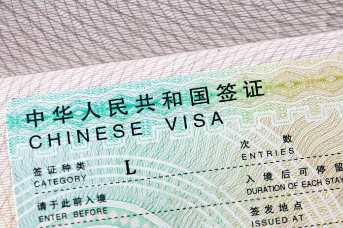 shutterstock_1730072584 Chinese visa document close-up