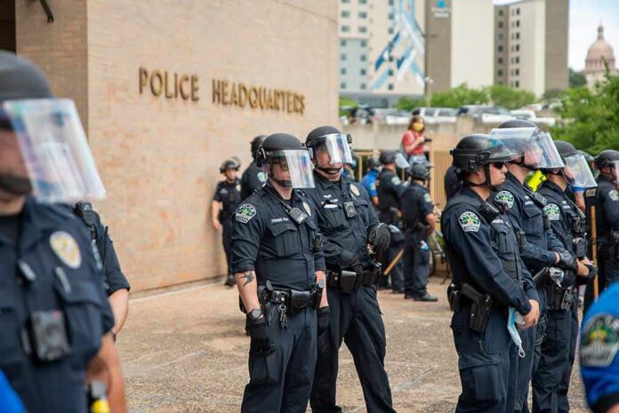 Teddy Williams and Carlos Hyde among police officers in riot gear outside police headquarters