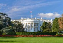 25 Years Later: The Policy That Won’t Die The White House with lawn and American flag