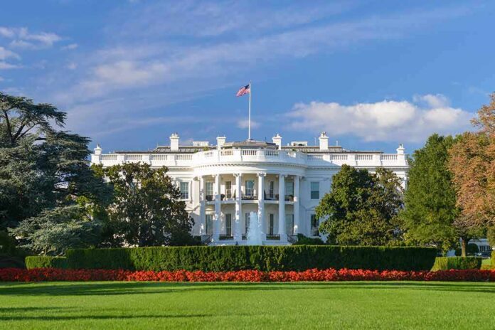 shutterstock_181171604 The White House with lawn and American flag