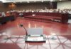 Premeditation Vs. Madness — Next Round Conference microphone on a podium in a courtroom