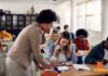 Teacher assisting student in classroom