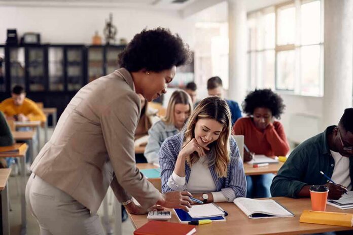 Teacher assisting student in classroom
