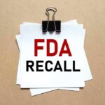 Class I Recall – Reasonable Probability Of Health Problems or Death Binder clip holding stacked papers labeled FDA recall