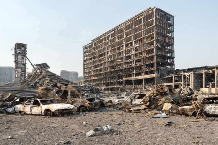 Burned-out cars amid a gutted high-rise building
