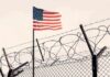 Major Incident Erupts Near US Air Base American flag above barbed wire fence