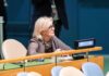 U.S. Walkout As Iran Torches America Woman seated at a United Nations desk with a United States nameplate