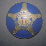 United States Secret Service badge emblem on blue background