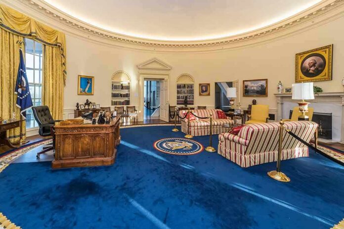 Oval Office interior with blue carpet and Resolute Desk