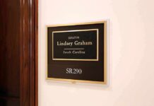 Senator Rich? Not This One office wall plaque with black and gold nameplate and room number