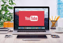 Fans Revolt – But Candace Owens Surges YouTube logo on a laptop screen on desk.