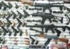 Wall display of assorted firearms in a gun shop