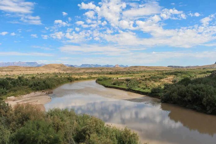 River winding through a desert valley under a blue sky