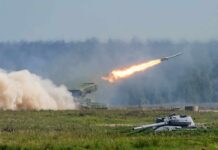Marines Roll Out Ship-Killer Trucks rocket launcher firing missile across a field
