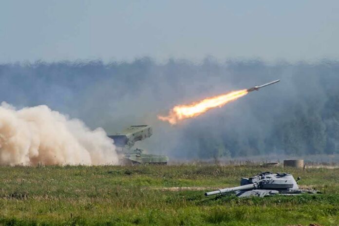 rocket launcher firing missile across a field