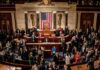 Leonard Lance and Claude Guéant among lawmakers on a legislative chamber floor