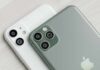 smartphones with dual and triple rear cameras on a light wood surface