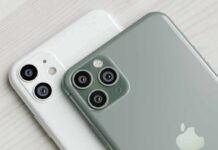smartphones with dual and triple rear cameras on a light wood surface