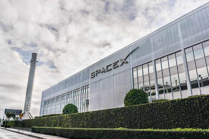 SpaceX headquarters exterior with rocket booster and hedge