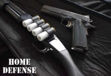 Shotgun and handgun on a black case