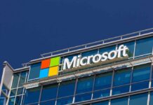 Microsoft’s AI Pivot: 60,000 on the Bubble Microsoft logo on a modern corporate building against a blue sky
