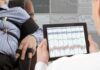 Ear Zaps – Severe Cases Hint BIG Drop Technician reviews polygraph readings on a tablet beside a seated subject