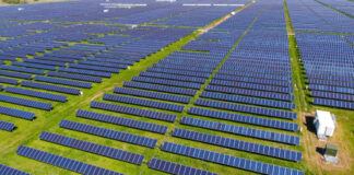 Aerial view of an expansive solar panel farm.