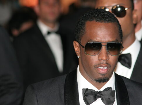 Sean Diddy, Man in suit and sunglasses at formal event