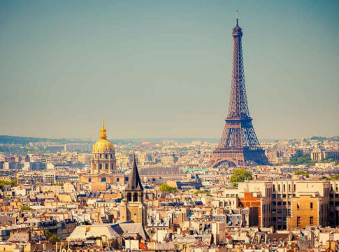 Eiffel Tower and Paris skyline in daylight.