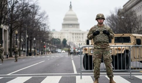 Soldier standing guard in front of the Capitol building