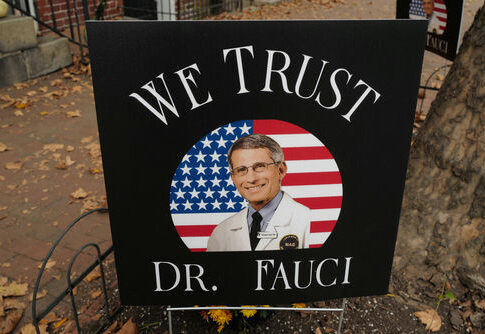 Sign reading We Trust Dr. Fauci on display.