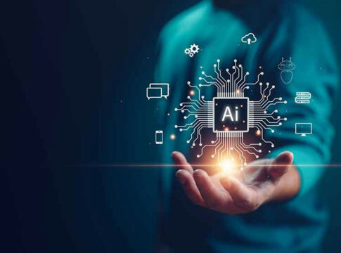 Person holding AI technology symbols in hand.