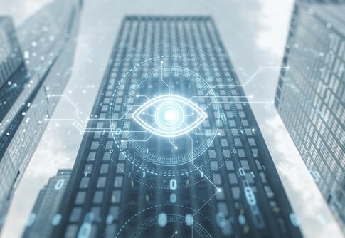 Futuristic digital overlay on a skyscraper with an eye symbol