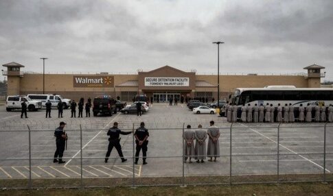 Law enforcement officers and detainees outside a secure detention facility at a Walmart location
