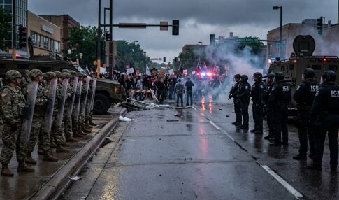 A tense standoff between law enforcement and protesters during a demonstration