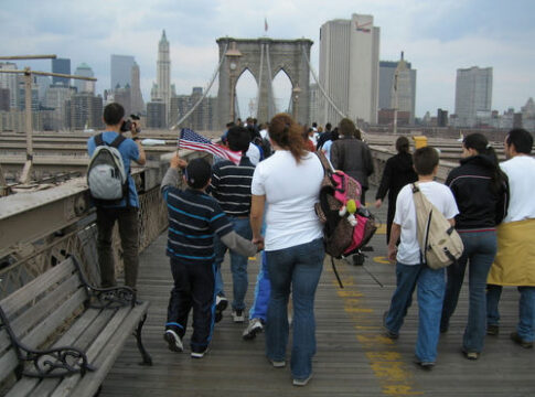 People walking on the Brooklyn Bridge, New York City.